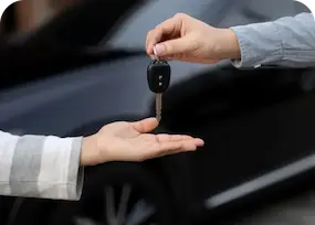 hands and car keys